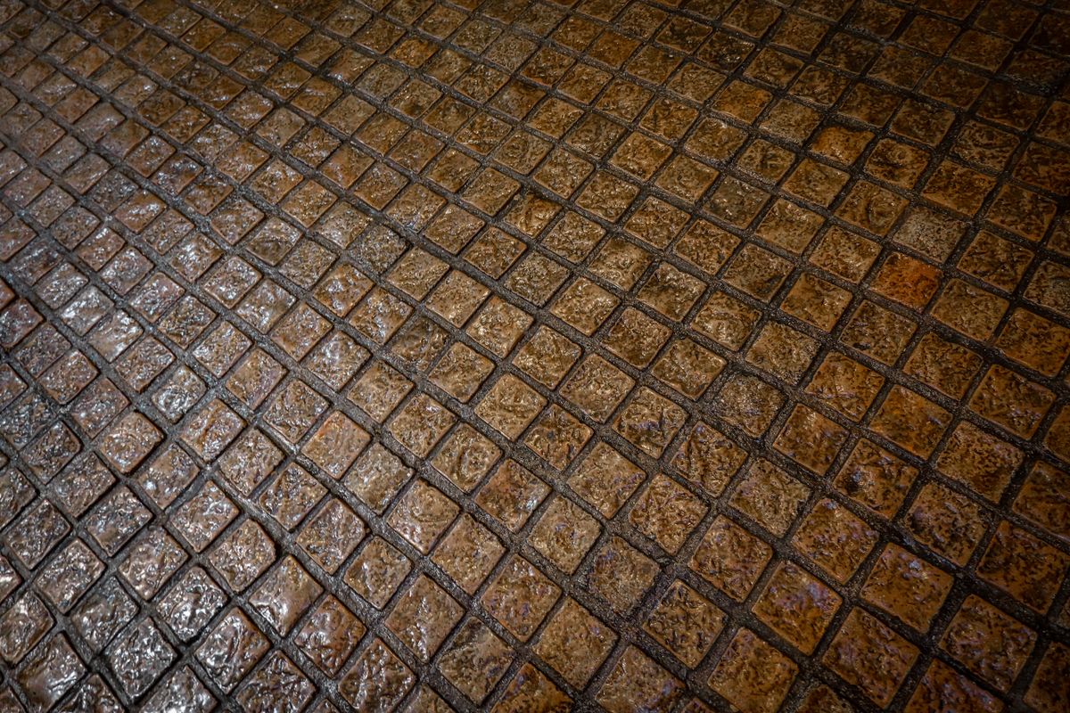 Wet cobblestones glistening after rain on an old European street