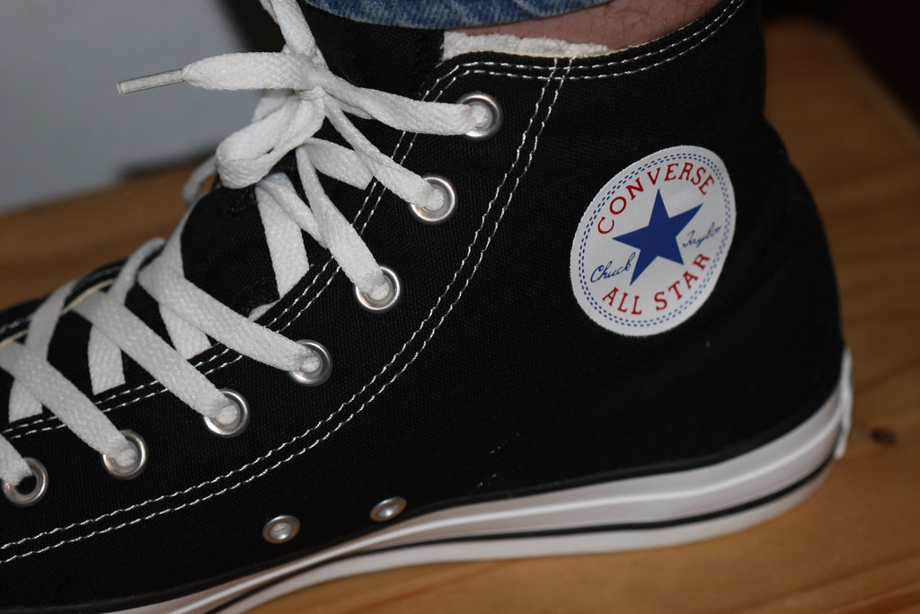 Black Converse Chuck Taylor All Star high-top sneakers with white laces