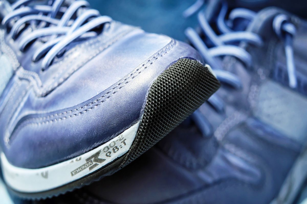Gray and white running shoes laced and ready