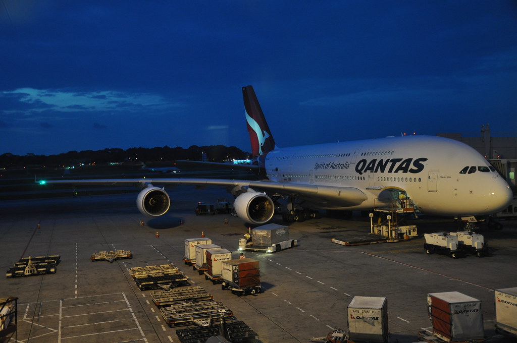 The aisle and cabin of a large passenger aircraft