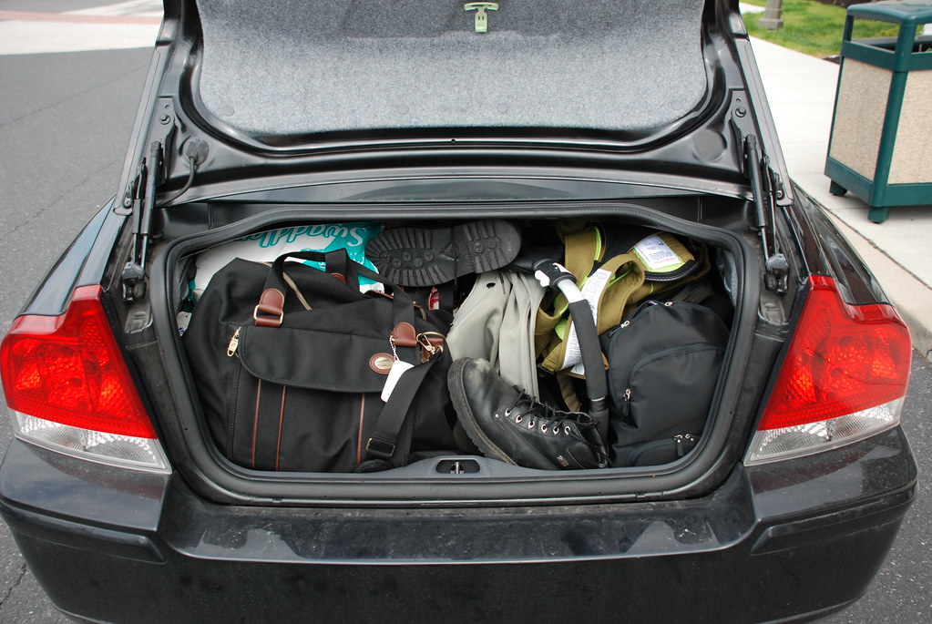 A car trunk packed full of bags and luggage